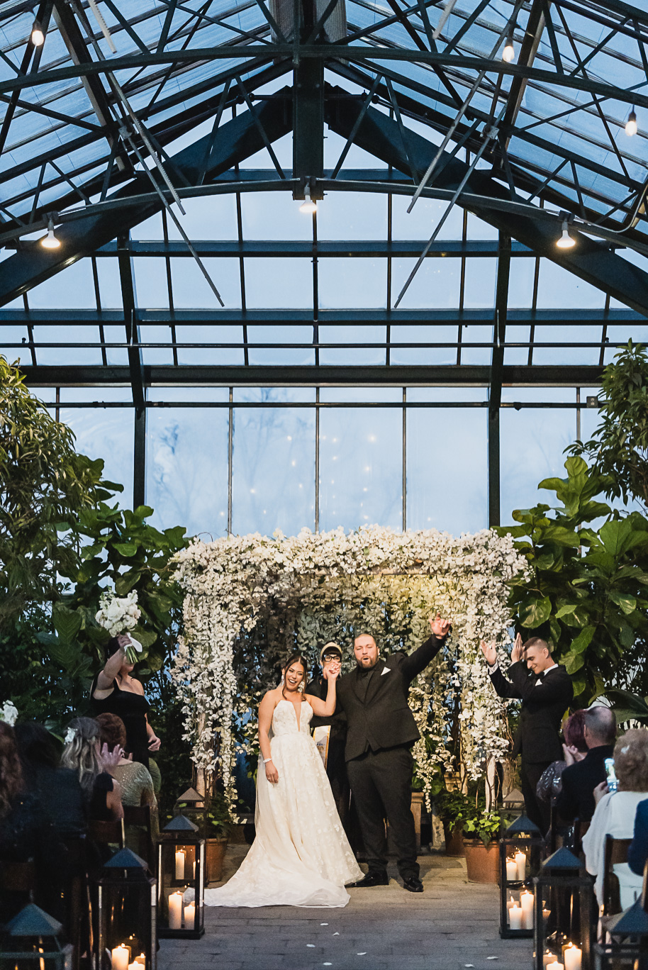 A classic black and white black tie winter Planterra wedding in West Bloomfield, Michigan provided by top-rated Detroit wedding photographer, Kari Dawson and her team.