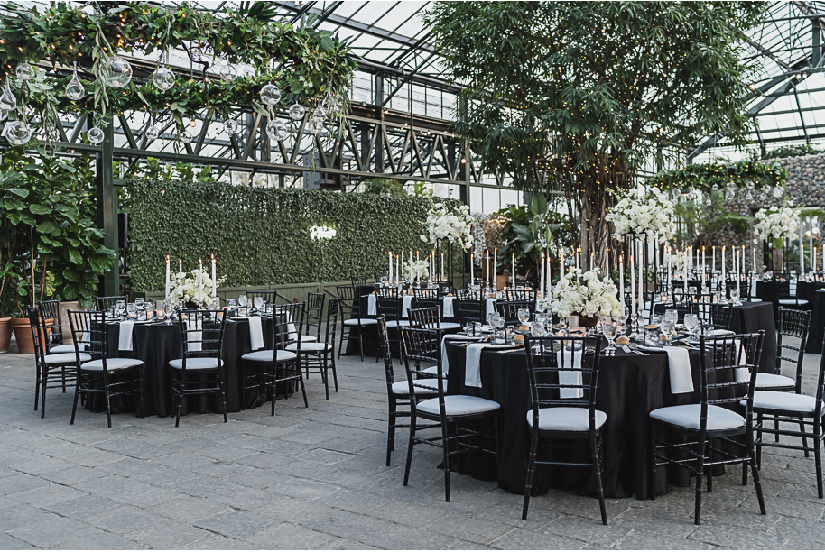 A classic black and white black tie winter Planterra wedding in West Bloomfield, Michigan provided by top-rated Detroit wedding photographer, Kari Dawson and her team.