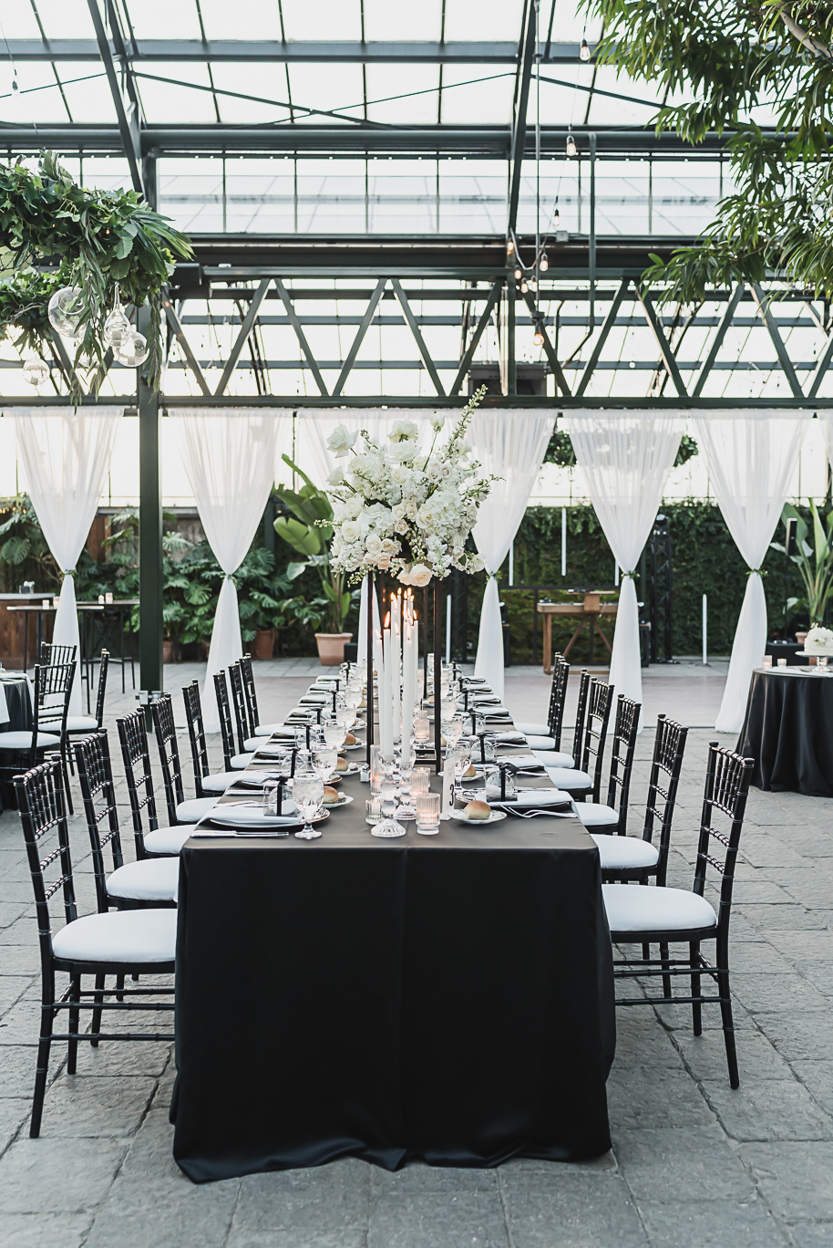 A classic black and white black tie winter Planterra wedding in West Bloomfield, Michigan provided by top-rated Detroit wedding photographer, Kari Dawson and her team.