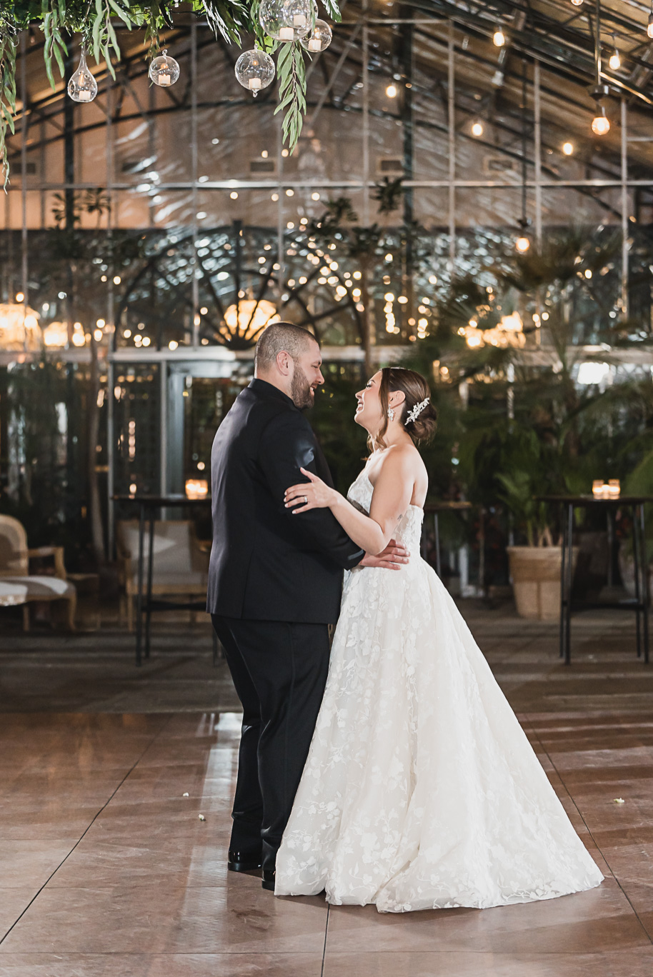 A classic black and white black tie winter Planterra wedding in West Bloomfield, Michigan provided by top-rated Detroit wedding photographer, Kari Dawson and her team.