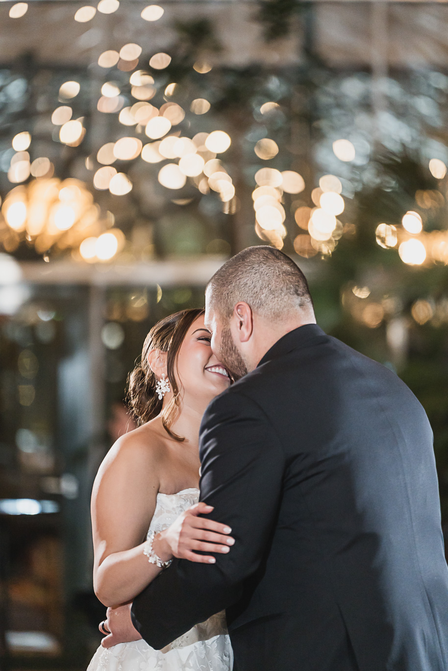 A classic black and white black tie winter Planterra wedding in West Bloomfield, Michigan provided by top-rated Detroit wedding photographer, Kari Dawson and her team.