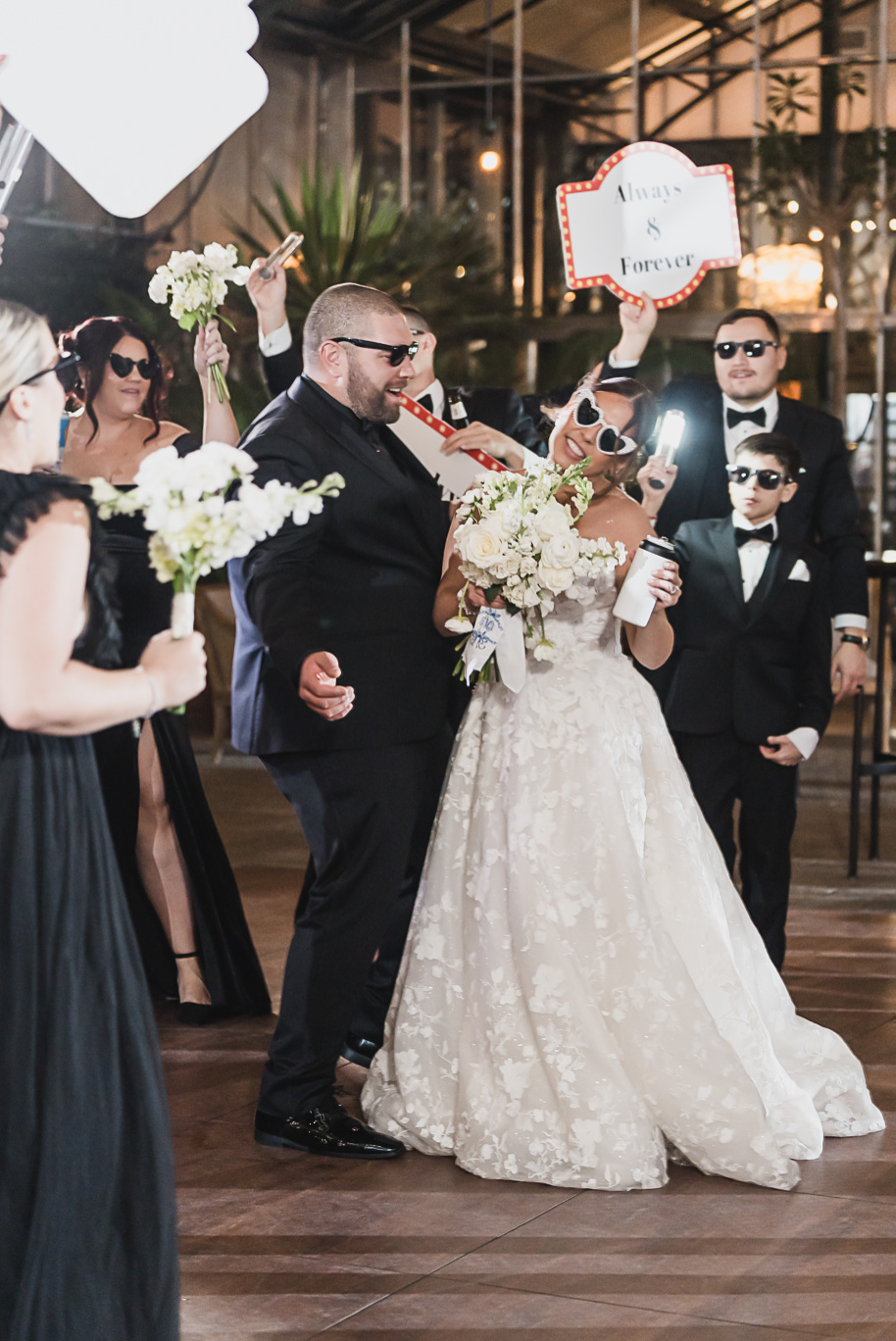 A classic black and white black tie winter Planterra wedding in West Bloomfield, Michigan provided by top-rated Detroit wedding photographer, Kari Dawson and her team.