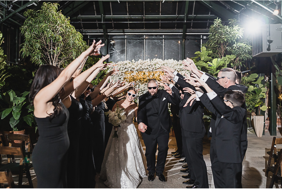 A classic black and white black tie winter Planterra wedding in West Bloomfield, Michigan provided by top-rated Detroit wedding photographer, Kari Dawson and her team.