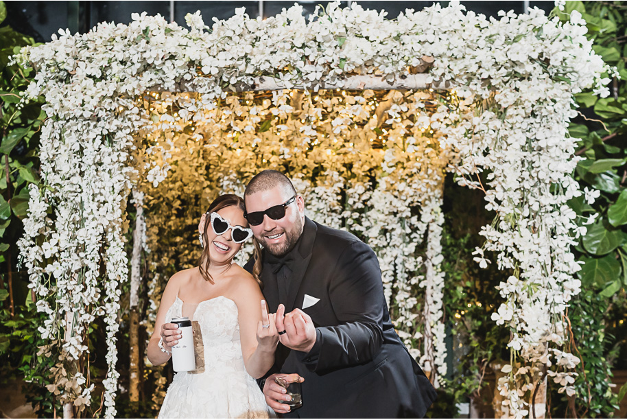 A classic black and white black tie winter Planterra wedding in West Bloomfield, Michigan provided by top-rated Detroit wedding photographer, Kari Dawson and her team.