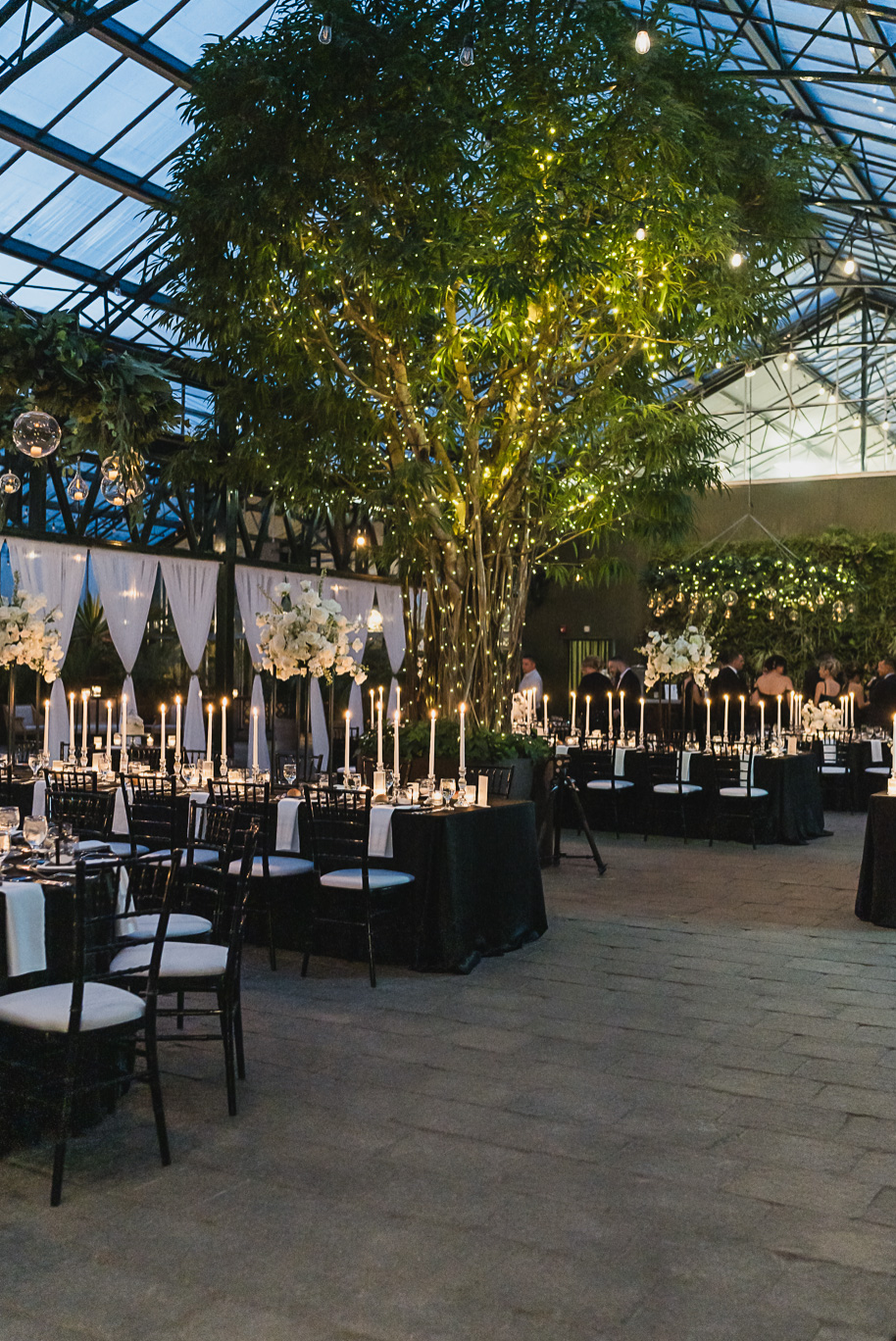 A classic black and white black tie winter Planterra wedding in West Bloomfield, Michigan provided by top-rated Detroit wedding photographer, Kari Dawson and her team.