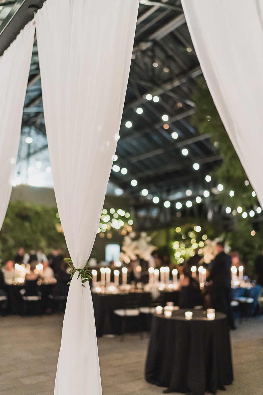 A classic black and white black tie winter Planterra wedding in West Bloomfield, Michigan provided by top-rated Detroit wedding photographer, Kari Dawson and her team.