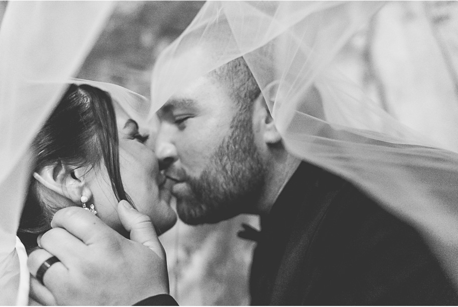 A classic black and white black tie winter Planterra wedding in West Bloomfield, Michigan provided by top-rated Detroit wedding photographer, Kari Dawson and her team.