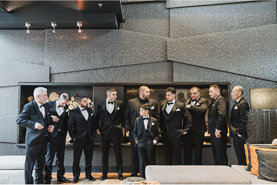 A classic black and white black tie winter Planterra wedding in West Bloomfield, Michigan provided by top-rated Detroit wedding photographer, Kari Dawson and her team.