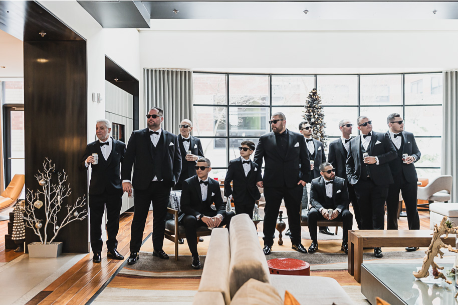 A classic black and white black tie winter Planterra wedding in West Bloomfield, Michigan provided by top-rated Detroit wedding photographer, Kari Dawson and her team.