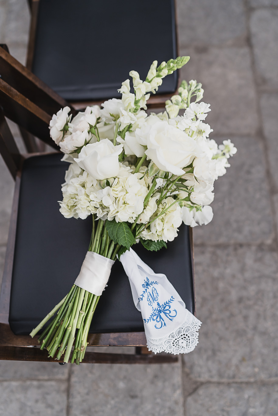 A classic black and white black tie winter Planterra wedding in West Bloomfield, Michigan provided by top-rated Detroit wedding photographer, Kari Dawson and her team.