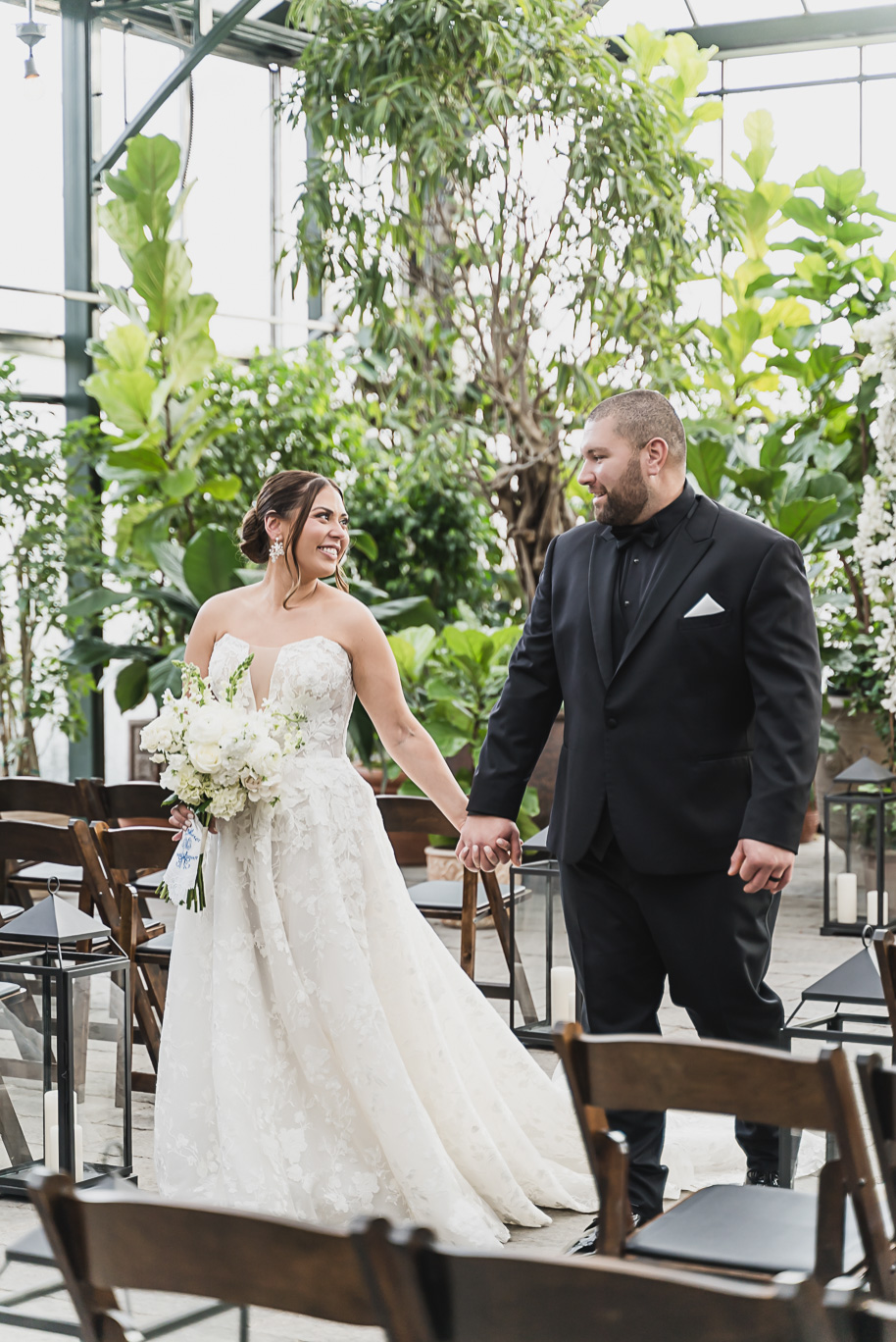 A classic black and white black tie winter Planterra wedding in West Bloomfield, Michigan provided by top-rated Detroit wedding photographer, Kari Dawson and her team.