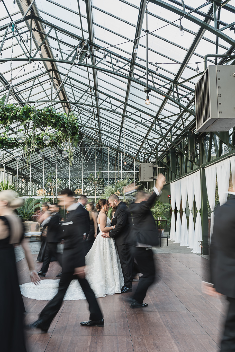 A classic black and white black tie winter Planterra wedding in West Bloomfield, Michigan provided by top-rated Detroit wedding photographer, Kari Dawson and her team.