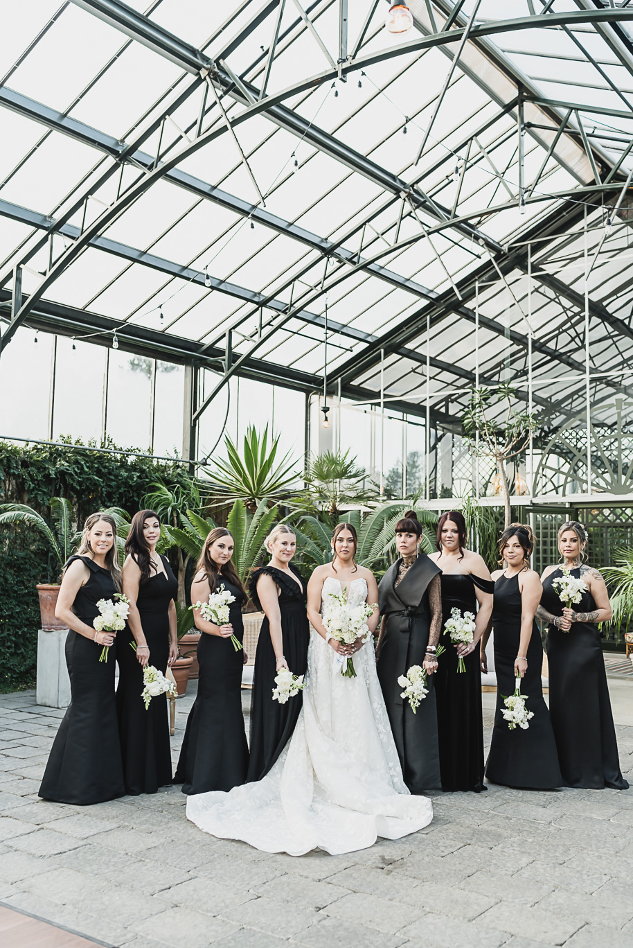 A classic black and white black tie winter Planterra wedding in West Bloomfield, Michigan provided by top-rated Detroit wedding photographer, Kari Dawson and her team.