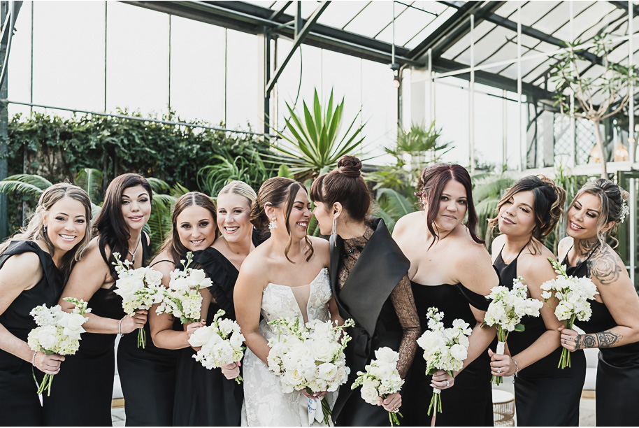 A classic black and white black tie winter Planterra wedding in West Bloomfield, Michigan provided by top-rated Detroit wedding photographer, Kari Dawson and her team.