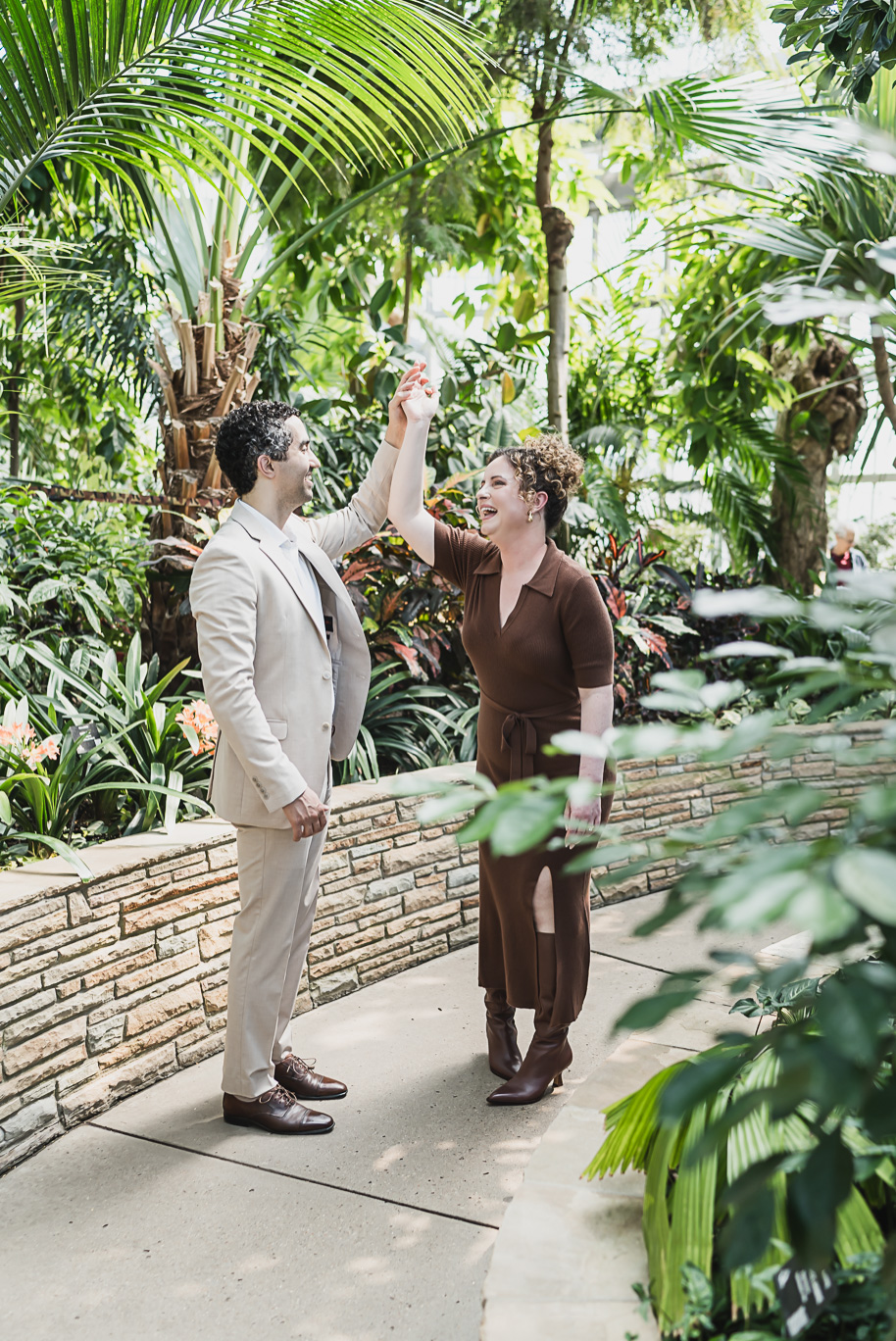 A Bell Isle Engagement Session Detroit waterfront engagement session with editorial cactus greenhouse moment — an intimate pause framed by texture and light.