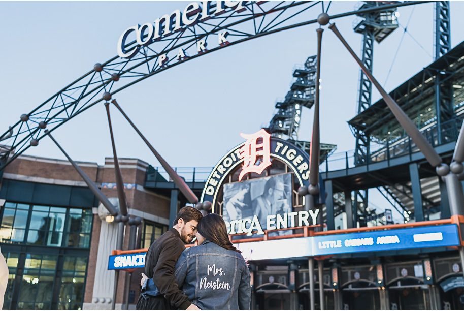 Downtown Detroit Engagement Photos l Close-up of Rachel’s denim jacket with “Mrs. Neistein” at Comerica Park