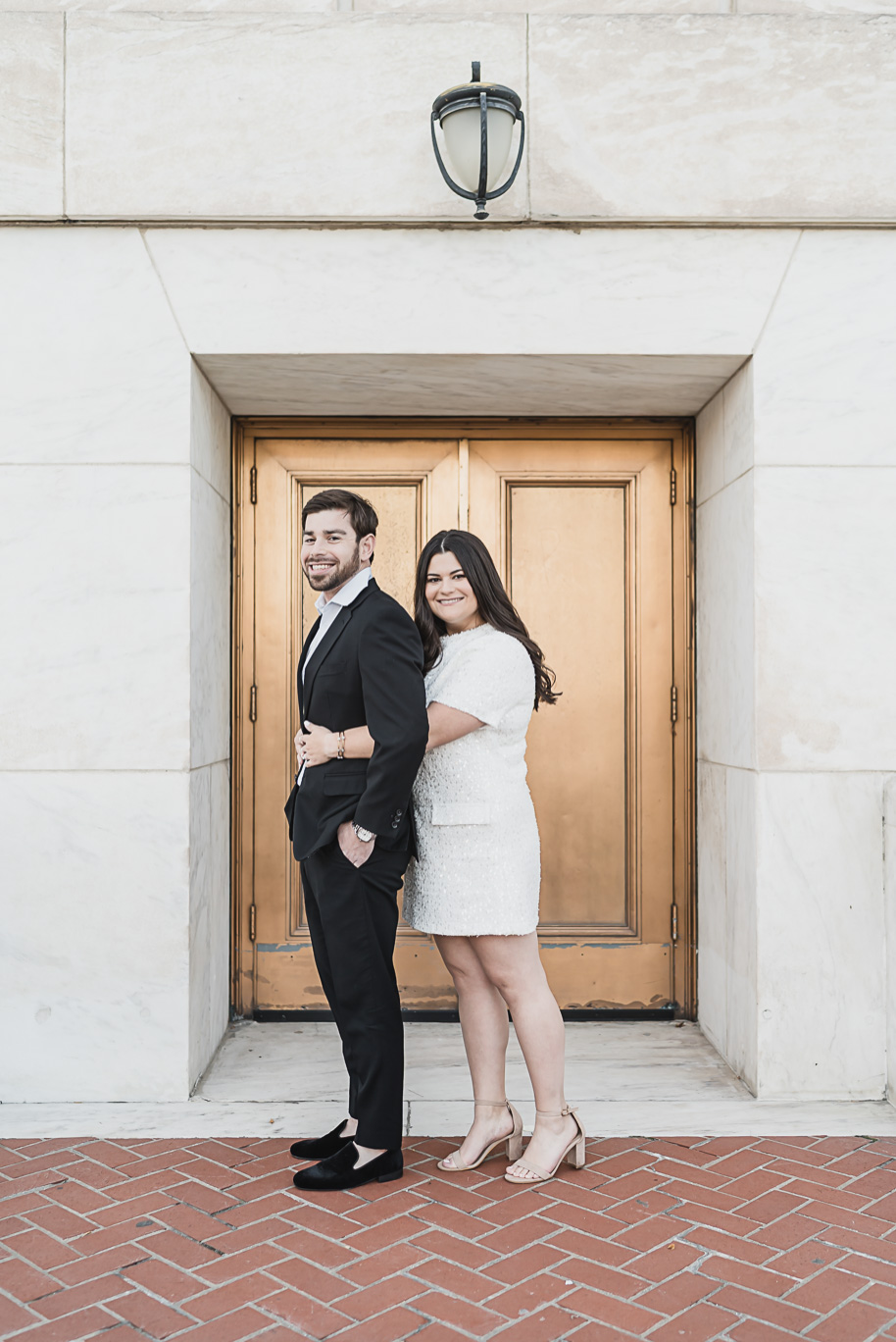 A fun candid moment for this couple during their Detroit Institute of Arts downtown Detroit Engagement photos by Kari Dawson
