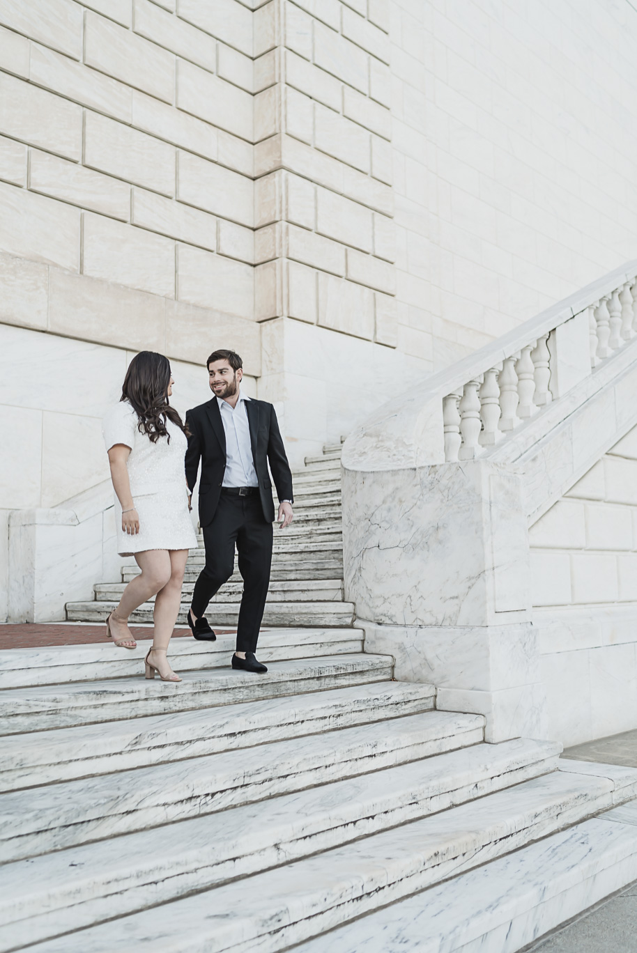 A fun candid moment for this couple during their Detroit Institute of Arts downtown Detroit Engagement photos by Kari Dawson