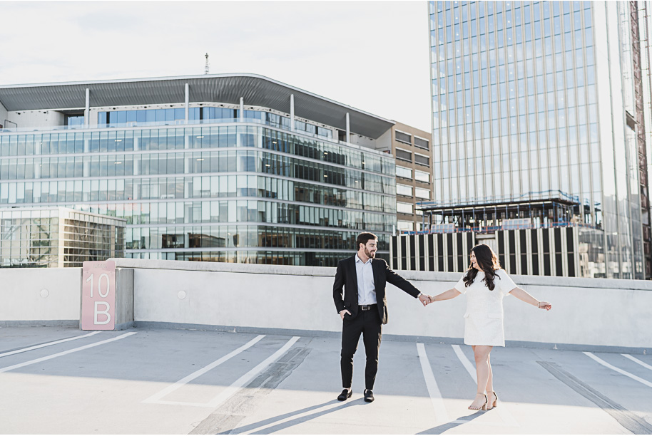 Dancing on the rooftop of the z lot during their downtown Detroit engagement photos by Kari Dawson