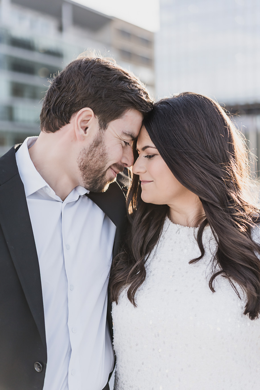 An intimate Z lot rooftop moment for Zach and Rachel's downtown Detroit engagement photos by Kari Dawson