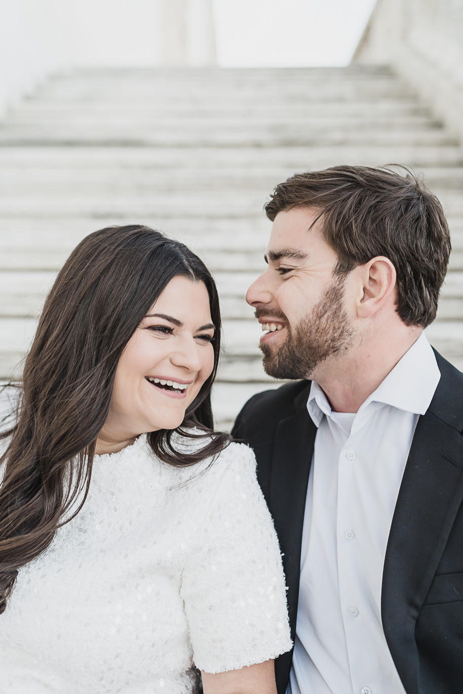 A fun candid moment for this couple during their Detroit Institute of Arts downtown Detroit Engagement photos by Kari Dawson
