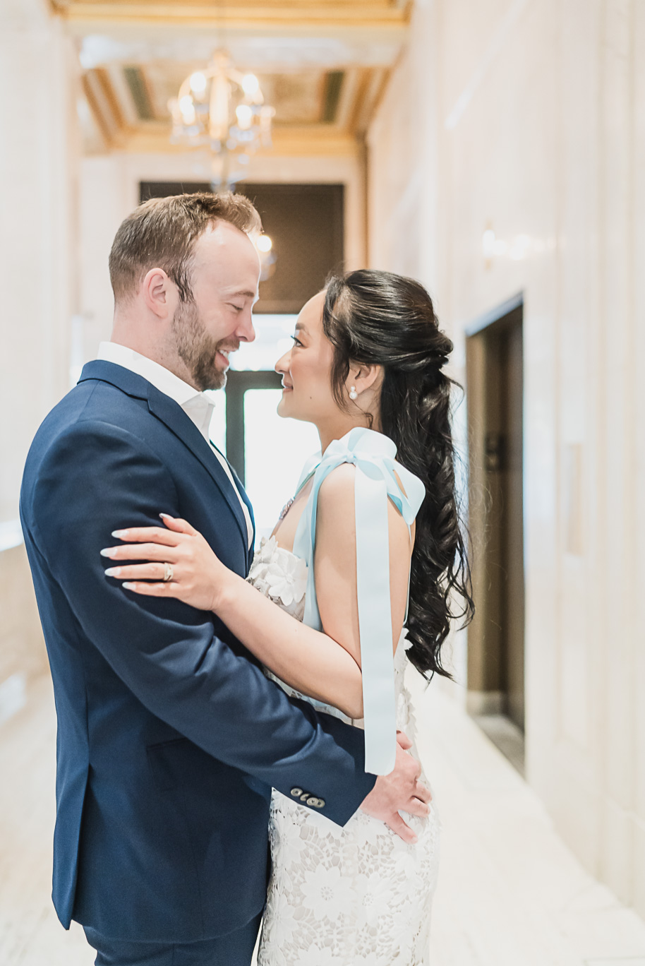 Book Tower engagement photos in Detroit by top-rated Detroit Wedding Photographers Kari Dawson + Co
