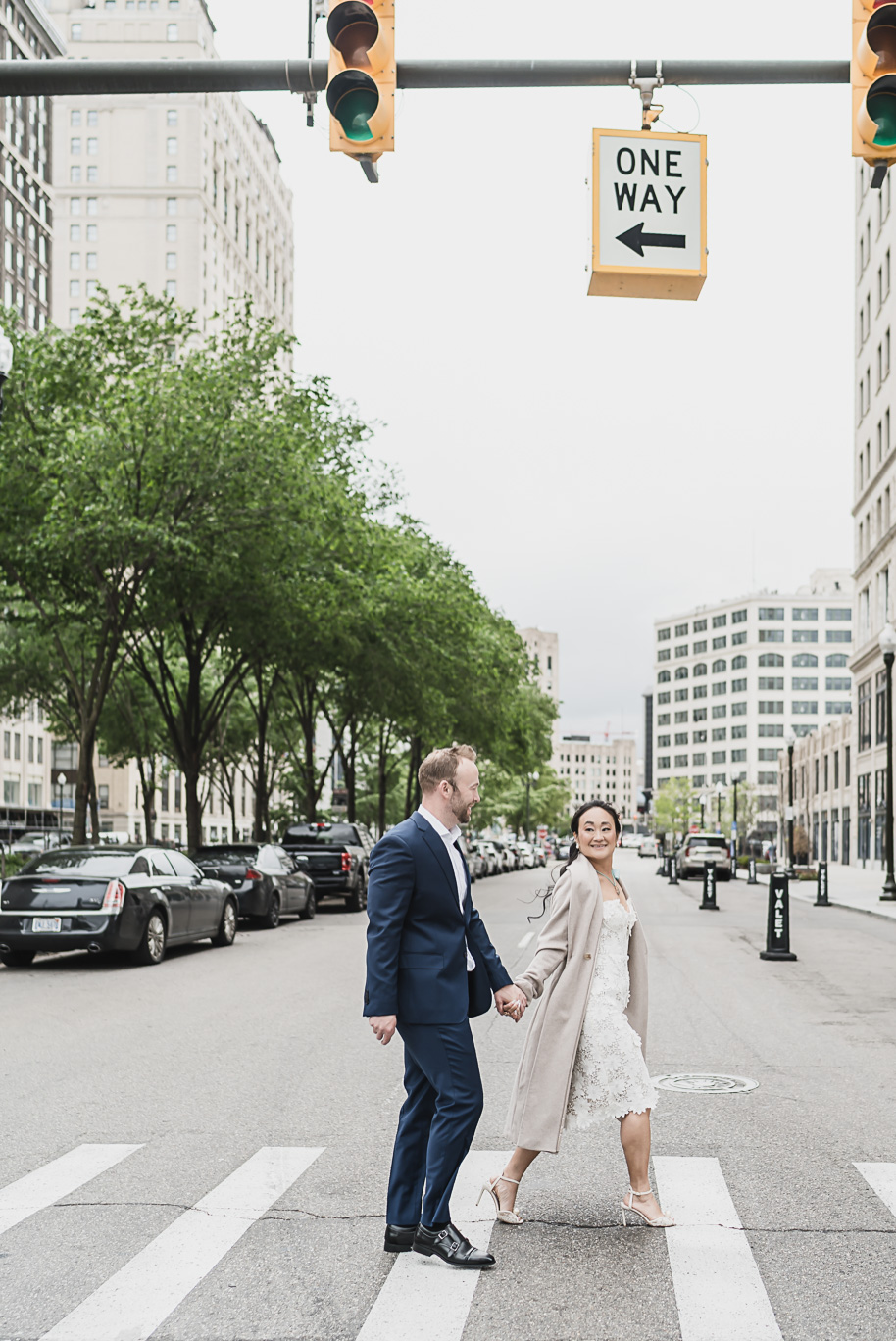 Book Tower engagement photos in Detroit by top-rated Detroit Wedding Photographers Kari Dawson + Co
