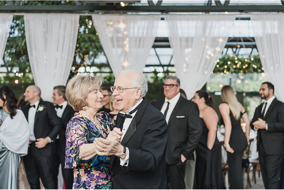 A summer black tie lush Planterra Conservatory Wedding same sex in West Bloomfield Michigan by Kari Dawson.