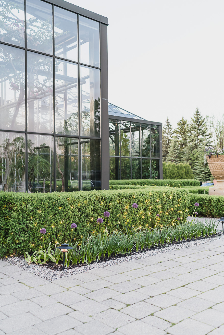 A summer black tie lush Planterra Conservatory Wedding same sex in West Bloomfield Michigan by Kari Dawson.