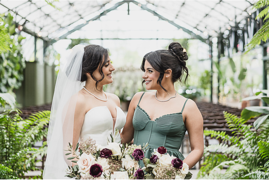 A summer black tie lush Planterra Conservatory Wedding same sex in West Bloomfield Michigan by Kari Dawson.