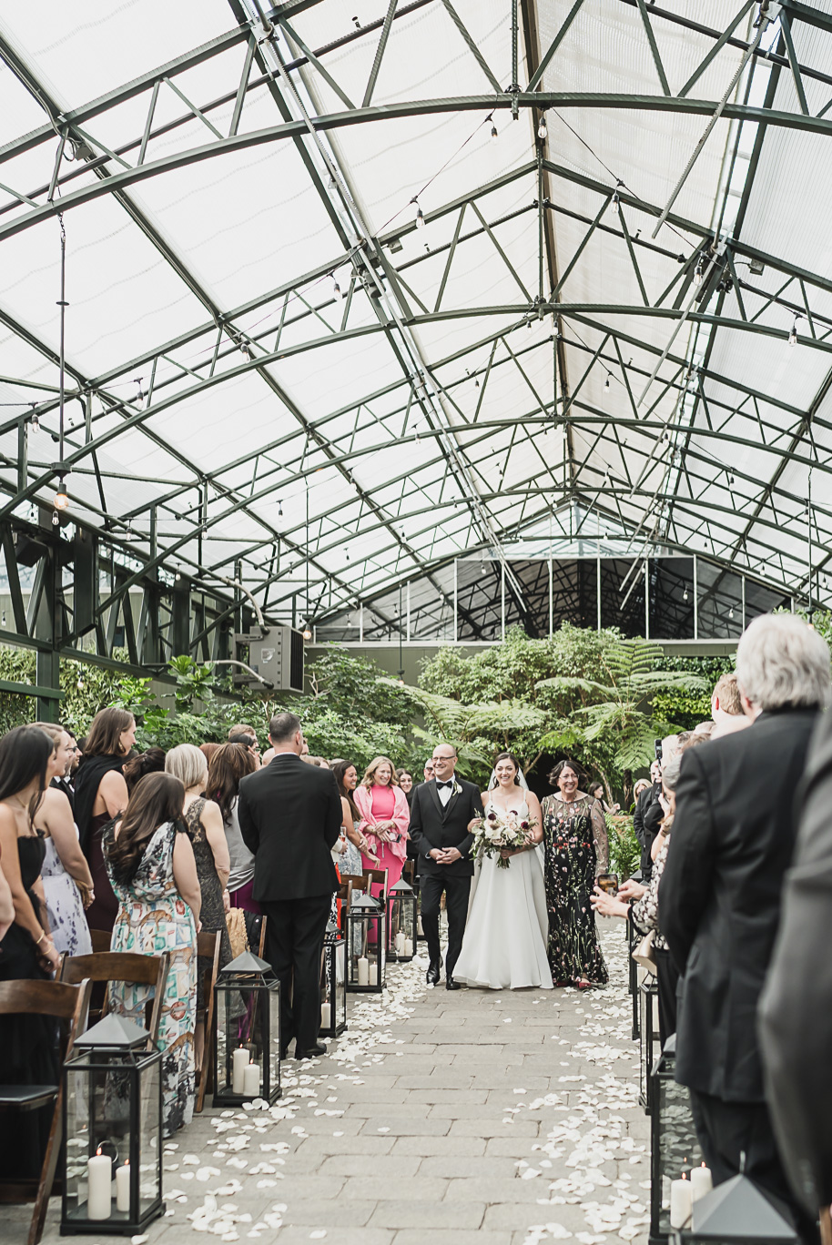 A summer black tie lush Planterra Conservatory Wedding same sex in West Bloomfield Michigan by Kari Dawson.