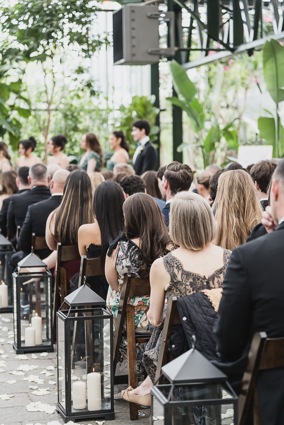 A summer black tie lush Planterra Conservatory Wedding same sex in West Bloomfield Michigan by Kari Dawson.