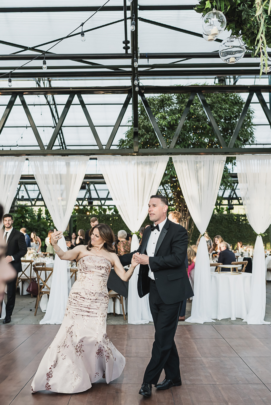 A summer black tie lush Planterra Conservatory Wedding same sex in West Bloomfield Michigan by Kari Dawson.