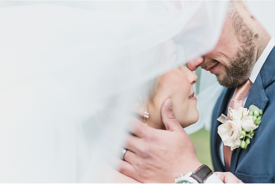 Dusty rose and navy wedding at Tobacco Ranch with sunset portraits and emotional ceremony