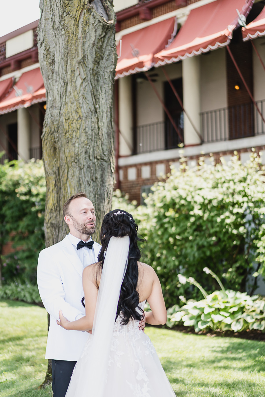 A classic black tie dusty blue and black Detroit Yacht Club wedding steeped in tradition, family heirlooms, hydrangaes, and happy tears by Kari Dawson, top rated Detroit wedding photographer, and her team. 
