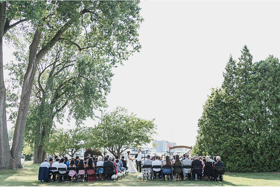 A classic black tie dusty blue and black Detroit Yacht Club wedding steeped in tradition, family heirlooms, hydrangaes, and happy tears by Kari Dawson, top rated Detroit wedding photographer, and her team. 