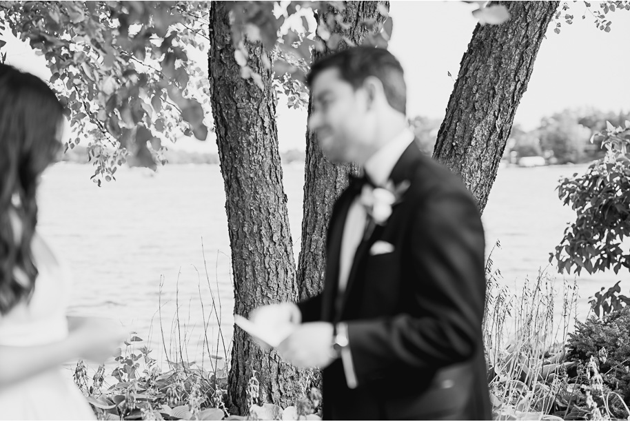 Bride and groom share handwritten vows during their outdoor Jewish wedding ceremony at Bay Pointe on Middle Straits Lake, photographed by Kari Dawson + Co.