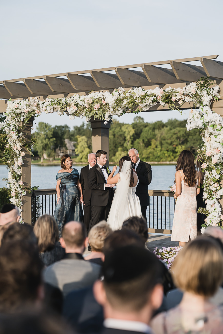 A jewish Bay Pointe Golf Club wedding on Middle Straights Lake provided by top-rated Detroit wedding photographer Kari Dawson + Co.