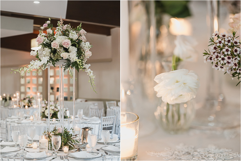 Romantic Bay Pointe Golf Club reception with tall floral centerpieces, soft candlelight, and clear chiavari chairs creating an elegant ballroom atmosphere.