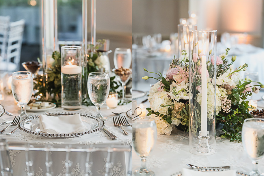 Romantic Bay Pointe Golf Club reception with tall floral centerpieces, soft candlelight, and clear chiavari chairs creating an elegant ballroom atmosphere.
