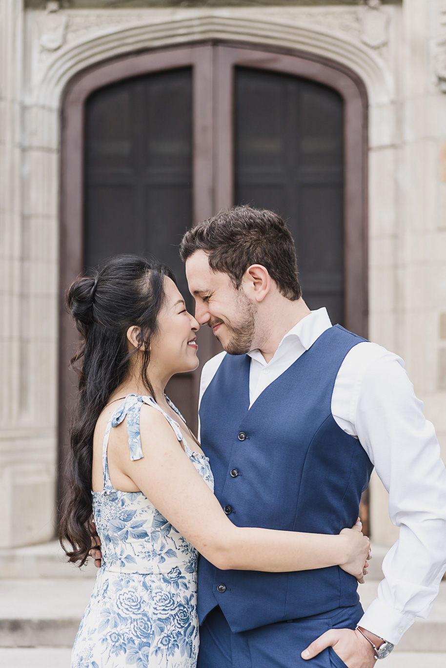 Close-up of an engaged couple smiling nose-to-nose during their Michigan Law Quad engagement session, showcasing timeless love and elegant style in Ann Arbor.