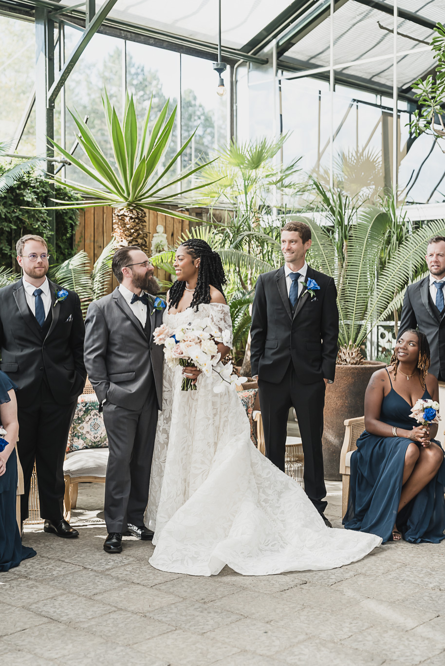 An elegant fall Planterra Conservatory wedding captured by Kari Dawson + Co in Bloomfield Hills, Michigan. This Euro-inspired greenhouse celebration featured lush floral design, golden candlelight, and heartfelt vows beneath the glass canopy. Perfect inspiration for couples dreaming of a romantic Michigan wedding surrounded by nature and timeless architecture.