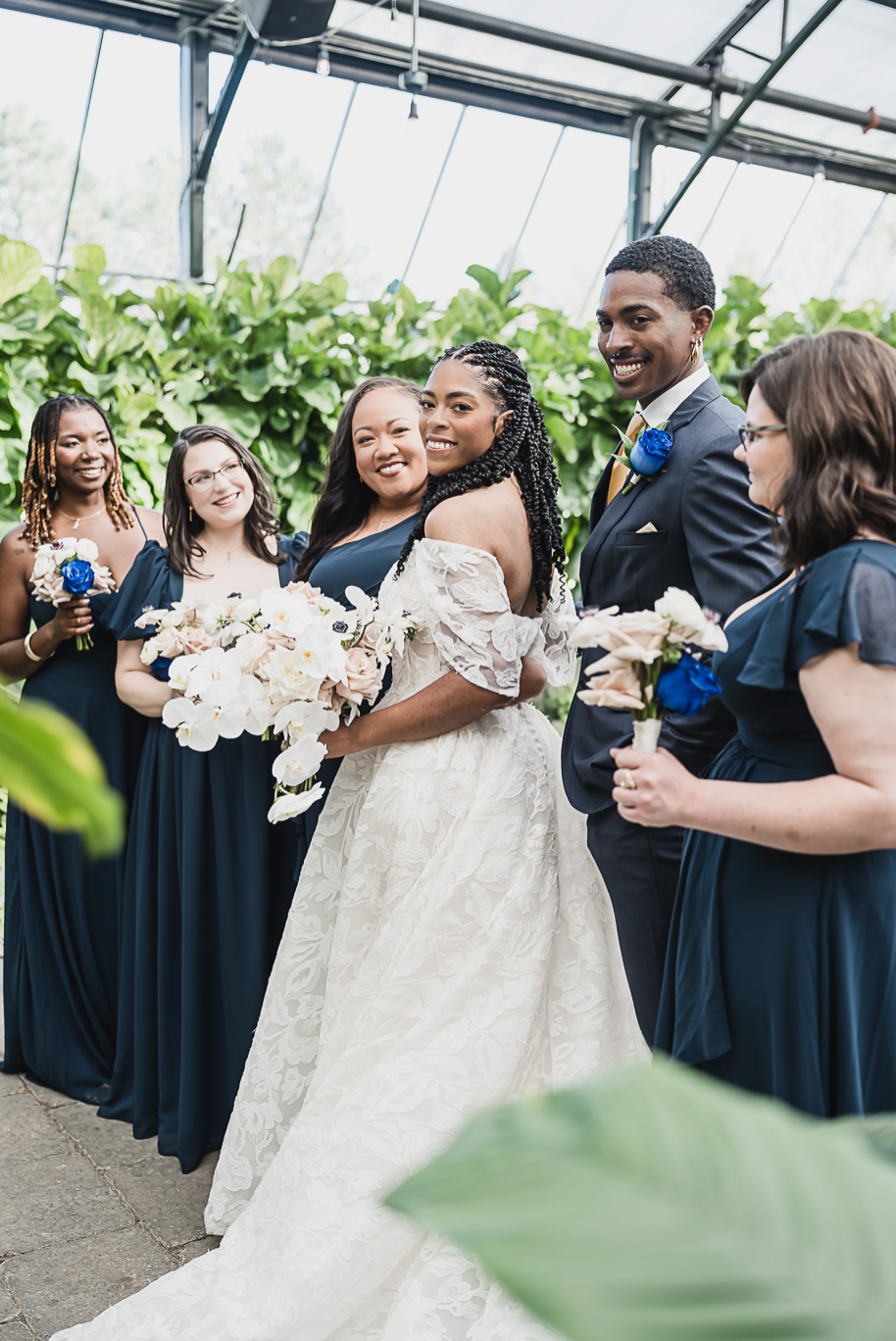 An elegant fall Planterra Conservatory wedding captured by Kari Dawson + Co in Bloomfield Hills, Michigan. This Euro-inspired greenhouse celebration featured lush floral design, golden candlelight, and heartfelt vows beneath the glass canopy. Perfect inspiration for couples dreaming of a romantic Michigan wedding surrounded by nature and timeless architecture.