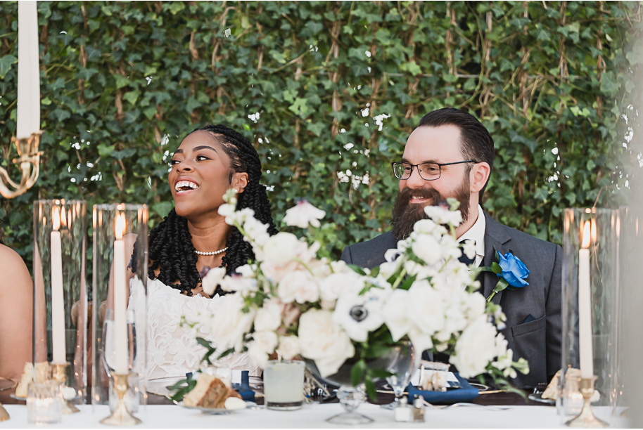 An elegant fall Planterra Conservatory wedding captured by Kari Dawson + Co in Bloomfield Hills, Michigan. This Euro-inspired greenhouse celebration featured lush floral design, golden candlelight, and heartfelt vows beneath the glass canopy. Perfect inspiration for couples dreaming of a romantic Michigan wedding surrounded by nature and timeless architecture.