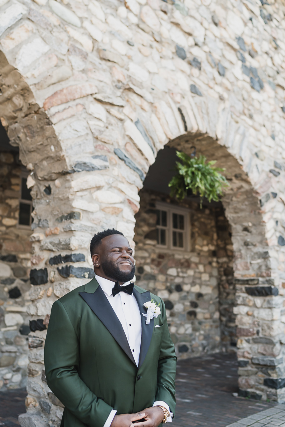 An emerald and gold fall interracial Castle Farms wedding in Charlevoix Northern Michigan by top-rated Northern Michigan wedding photography team Kari Dawson + Co.
