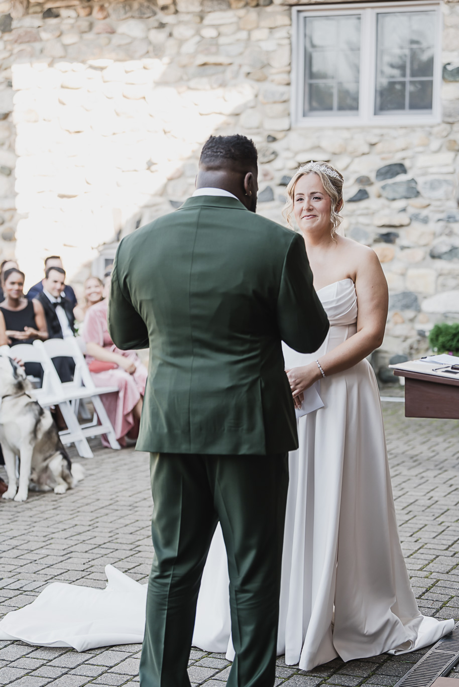 An emerald and gold fall interracial Castle Farms wedding in Charlevoix Northern Michigan by top-rated Northern Michigan wedding photography team Kari Dawson + Co.