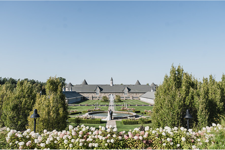 An emerald and gold fall interracial Castle Farms wedding in Charlevoix Northern Michigan by top-rated Northern Michigan wedding photography team Kari Dawson + Co.