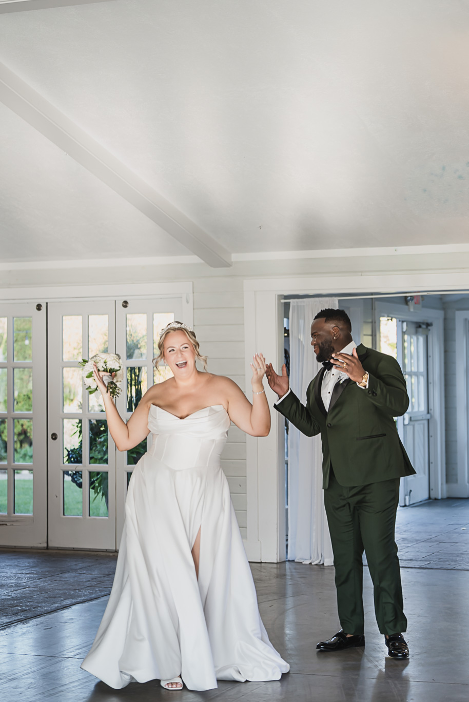 Bride and groom entrance at their An emerald and gold fall interracial Castle Farms wedding in Charlevoix Northern Michigan by top-rated Northern Michigan wedding photography team Kari Dawson + Co.