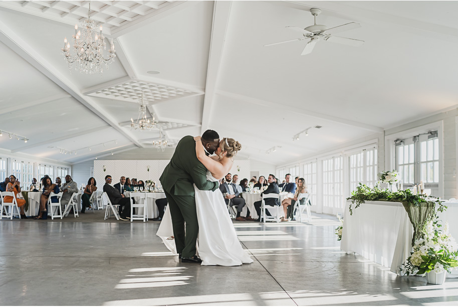 An emerald and gold fall interracial Castle Farms wedding in Charlevoix Northern Michigan by top-rated Northern Michigan wedding photography team Kari Dawson + Co.
