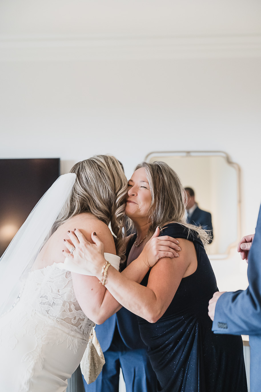 Romantic Royal Park Hotel wedding in Michigan with classic navy and sage details, warm family moments, and timeless photography by Kari Dawson.